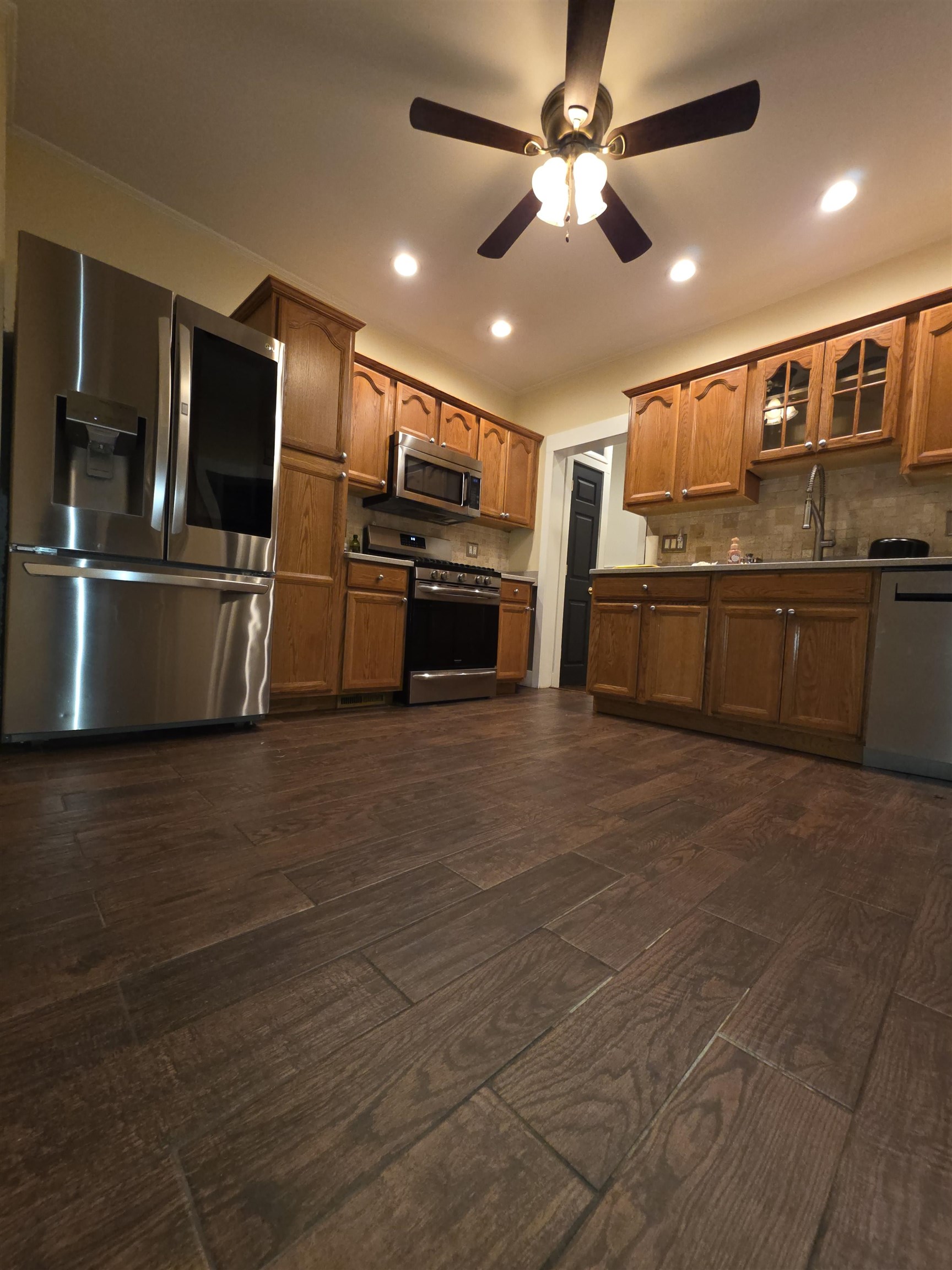 365 Avenue A, Unit 1 Bayonne, NJ 07002 - Photo 1 of 14 a kitchen with stainless steel appliances kitchen island granite countertop a refrigerator and a stove