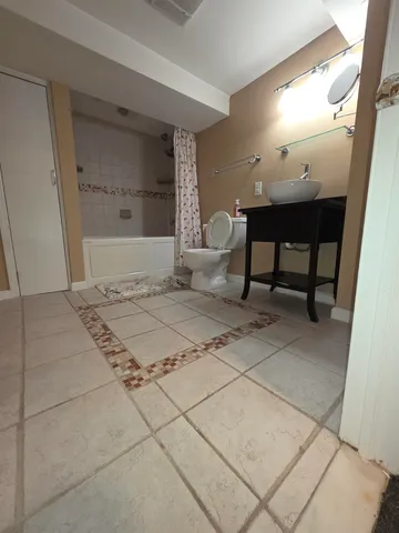 a bedroom with a bed and a table in it