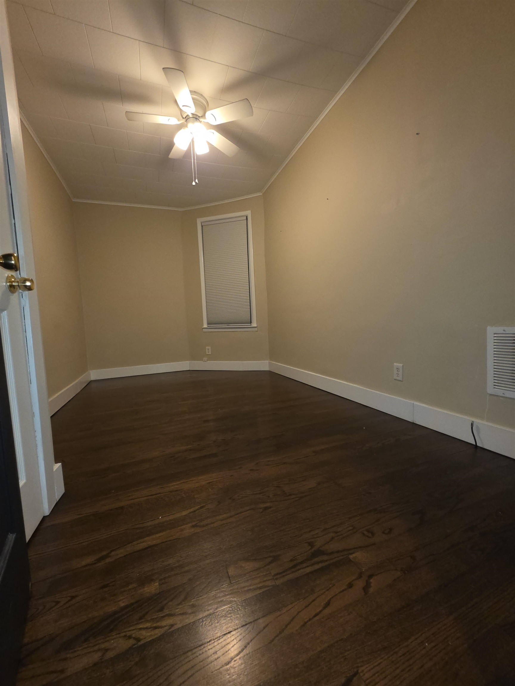 365 Avenue A, Unit 1 Bayonne, NJ 07002 - Photo 6 of 14 an empty room with wooden floor and fan