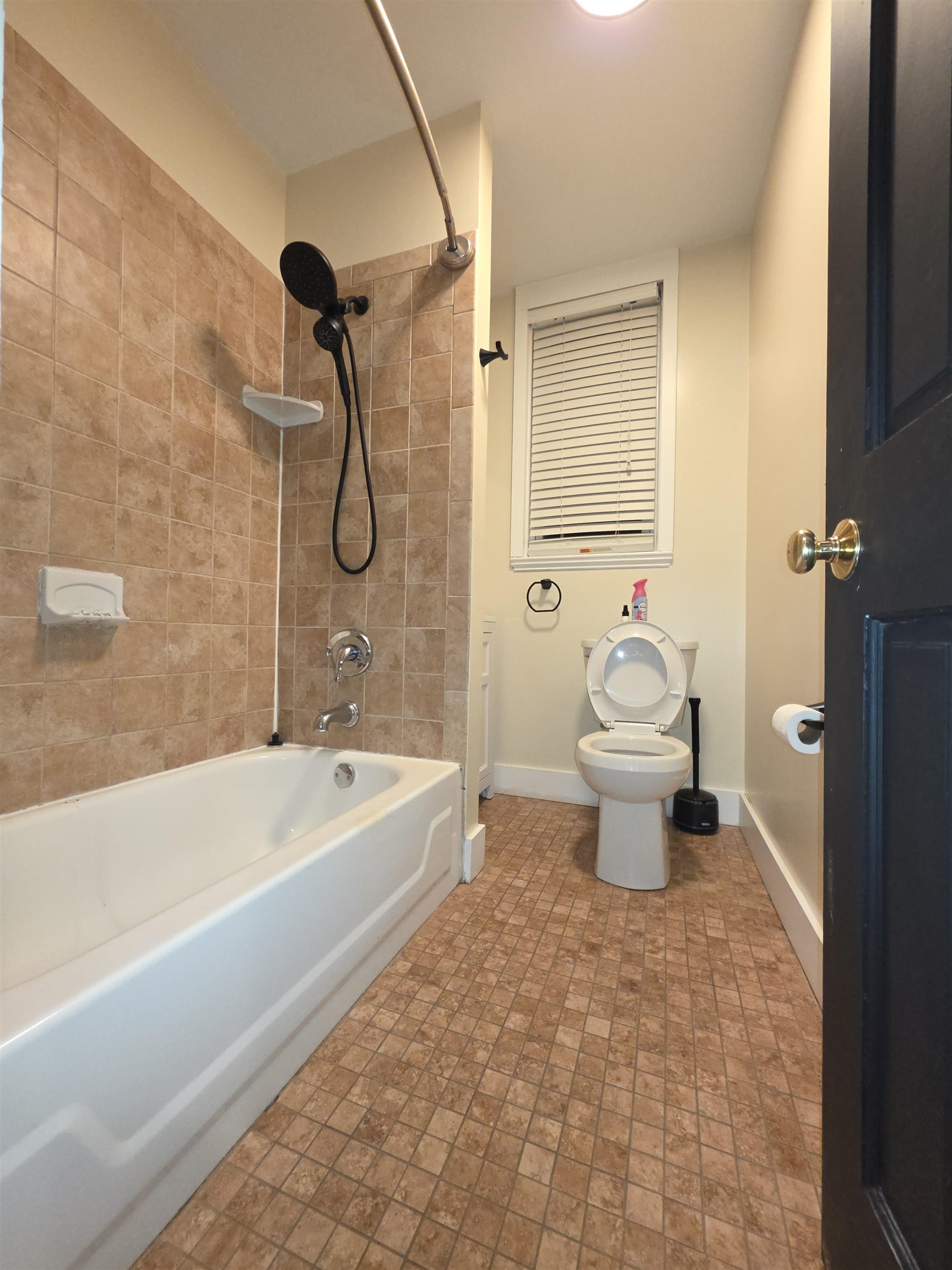 365 Avenue A, Unit 1 Bayonne, NJ 07002 - Photo 7 of 14 a bathroom with a toilet and a bath tub
