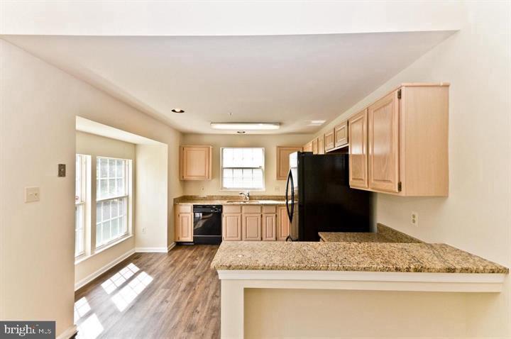 936 Millponds Court Bowie, MD 20721 - Photo 11 of 57 a kitchen with granite countertop cabinets and window