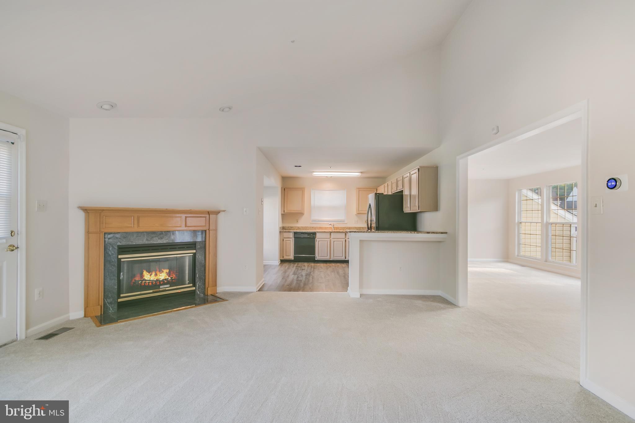 936 Millponds Court Bowie, MD 20721 - Photo 25 of 57 a view of kitchen and kitchen with fireplace