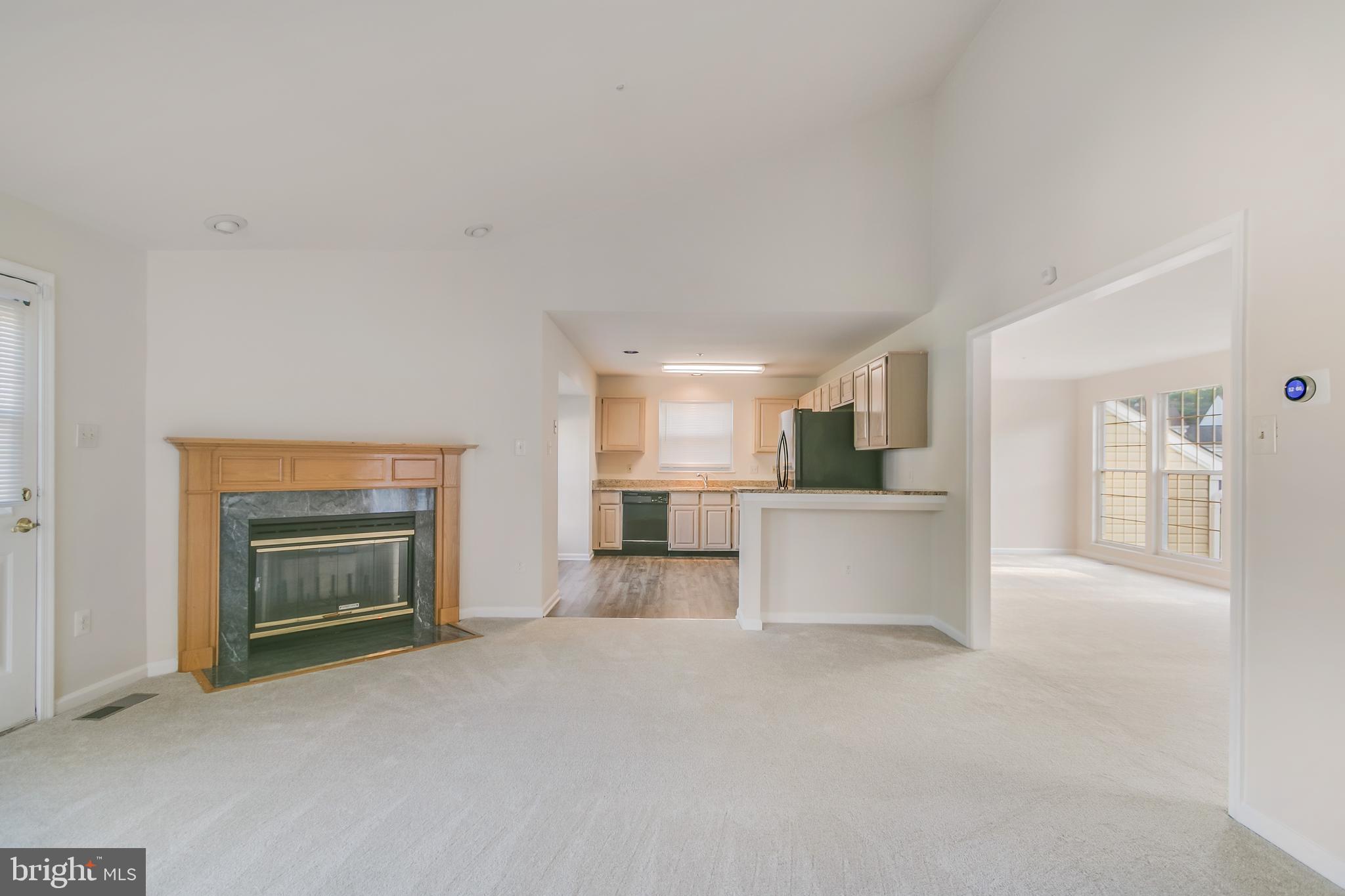 936 Millponds Court Bowie, MD 20721 - Photo 26 of 57 an empty room with a fireplace and cabinet