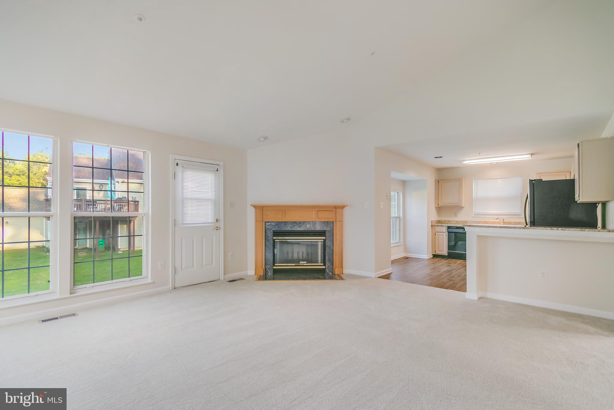 936 Millponds Court Bowie, MD 20721 - Photo 28 of 57 a view of a livingroom with a fireplace and window