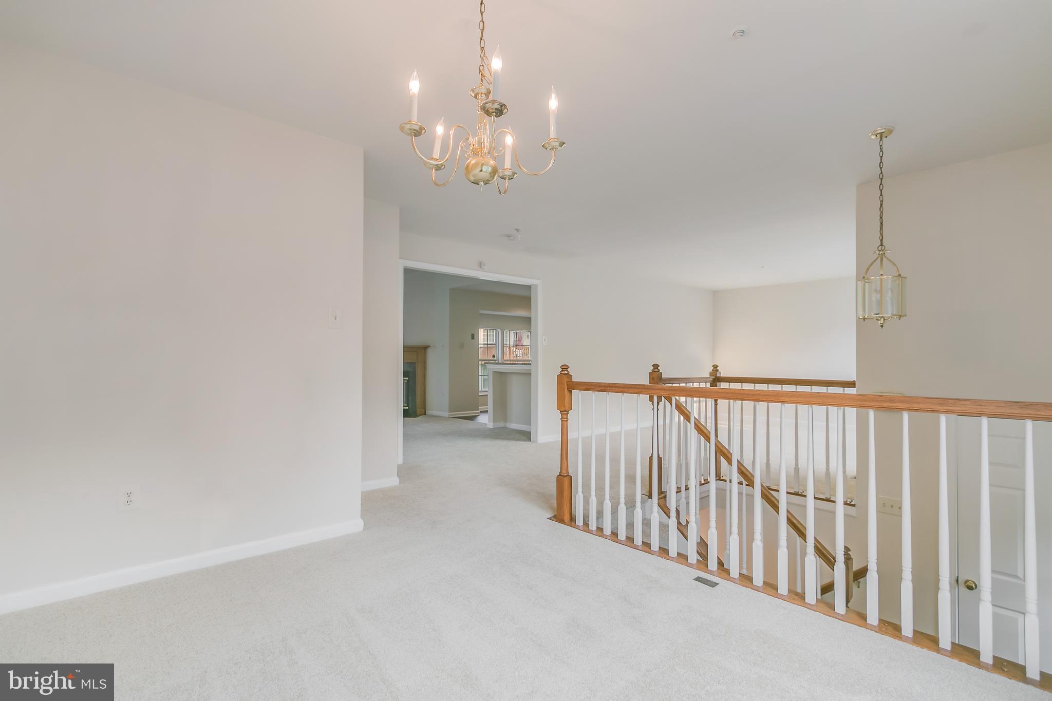 936 Millponds Court Bowie, MD 20721 - Photo 41 of 57 a view of a livingroom with a chandelier