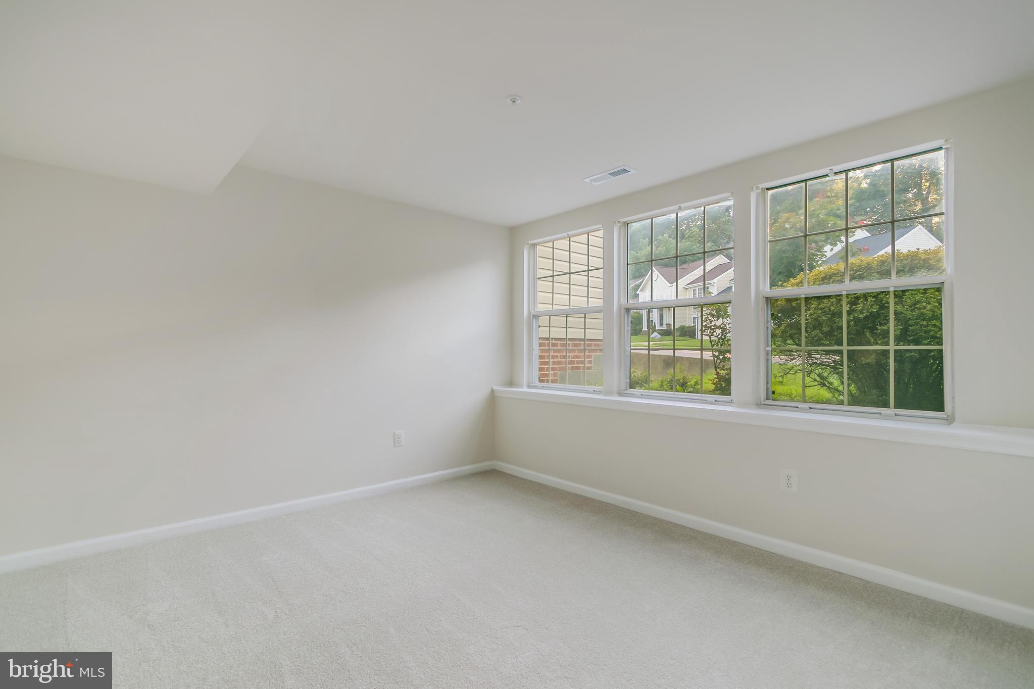 936 Millponds Court Bowie, MD 20721 - Photo 46 of 57 wooden floor in an empty room with a window