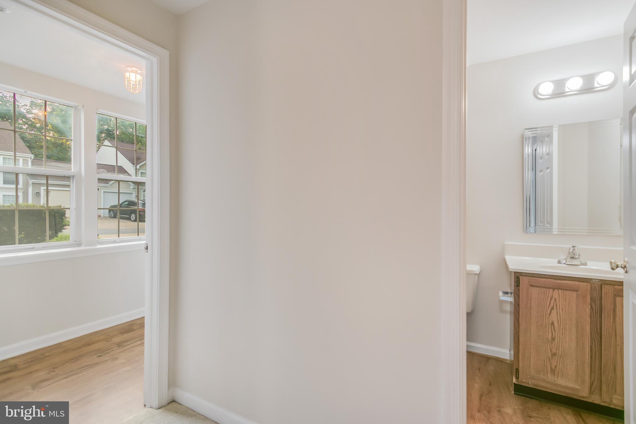 936 Millponds Court Bowie, MD 20721 - Photo 49 of 57 a bathroom with a sink and a mirror