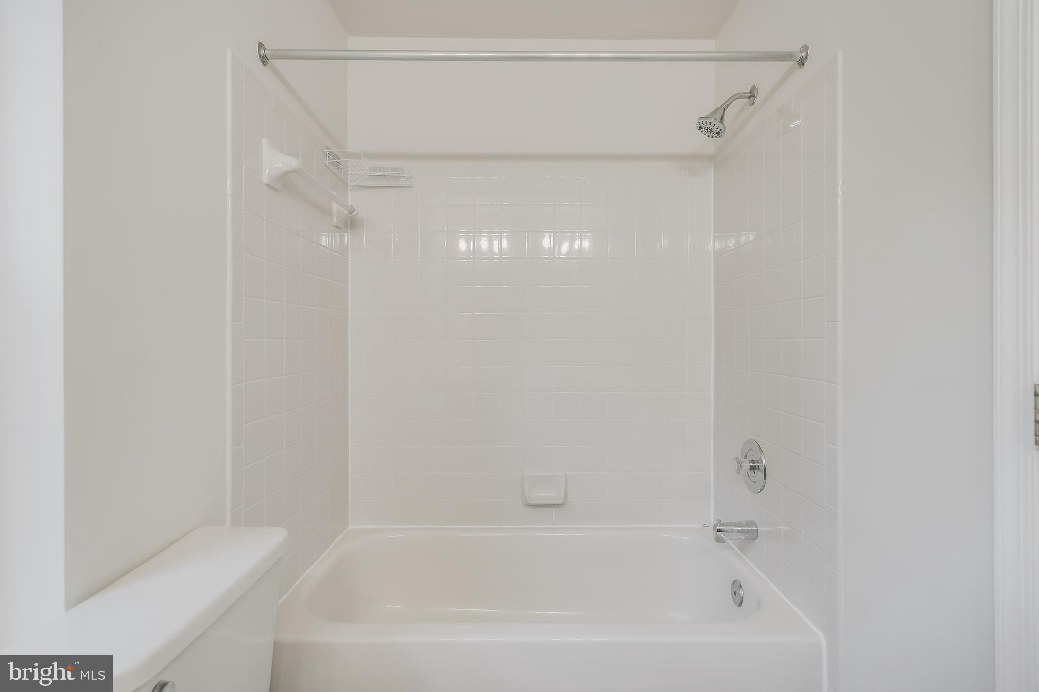 936 Millponds Court Bowie, MD 20721 - Photo 56 of 57 a close up of a bathtub in a bathroom