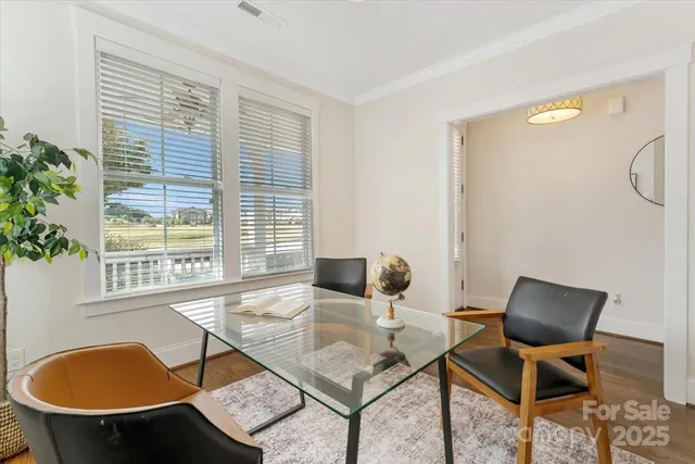a work room with furniture and a window