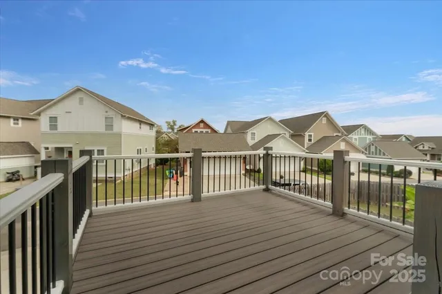 a view of a balcony with wooden floor