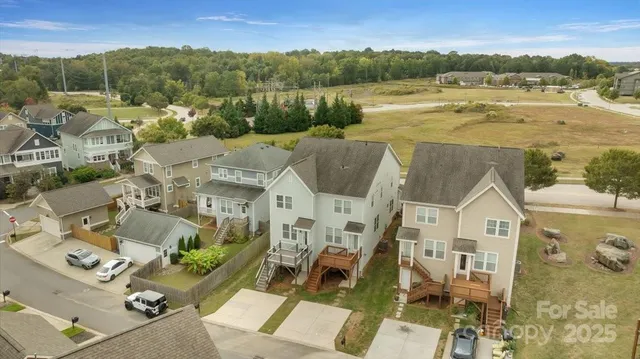 a view of multiple houses with a yard