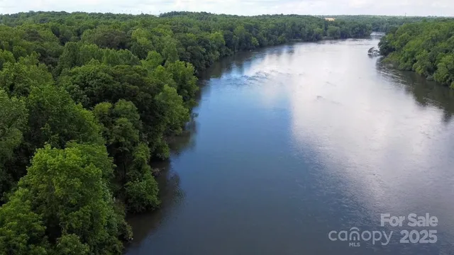 a view of a swimming pool with a yard