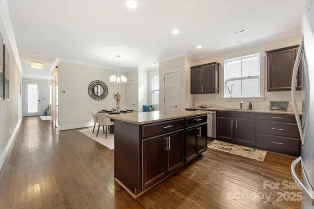 a kitchen with stainless steel appliances granite countertop a stove and a sink