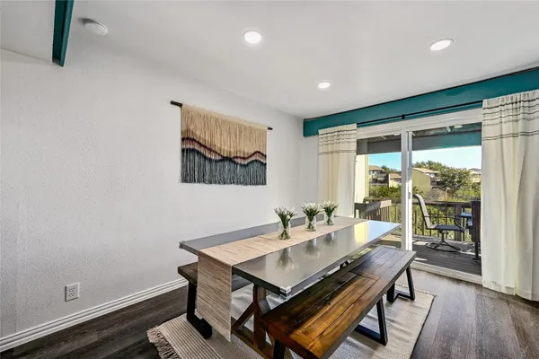 a view of a dining room with furniture and wooden floor