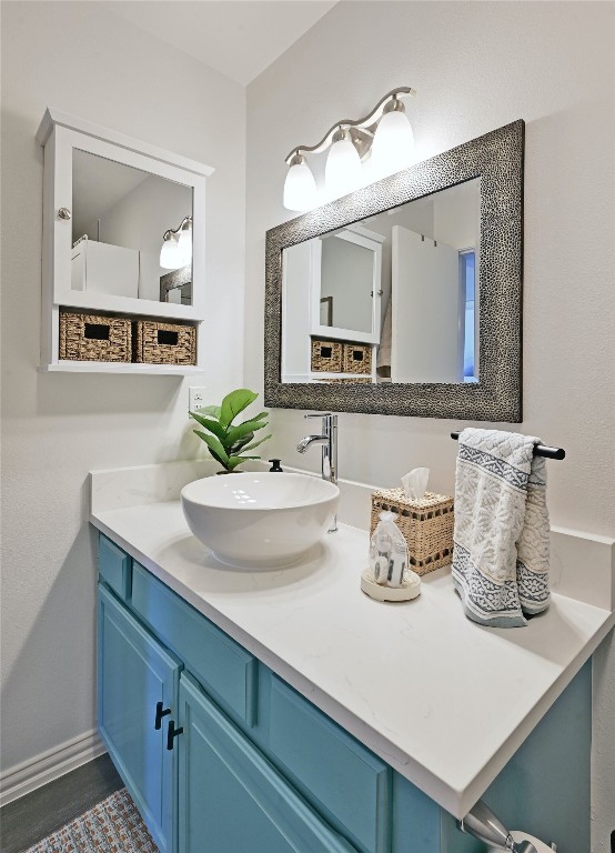 115 Comanche Drive Point Venture, TX 78645 - Photo 17 of 31 a bathroom with a sink and a mirror
