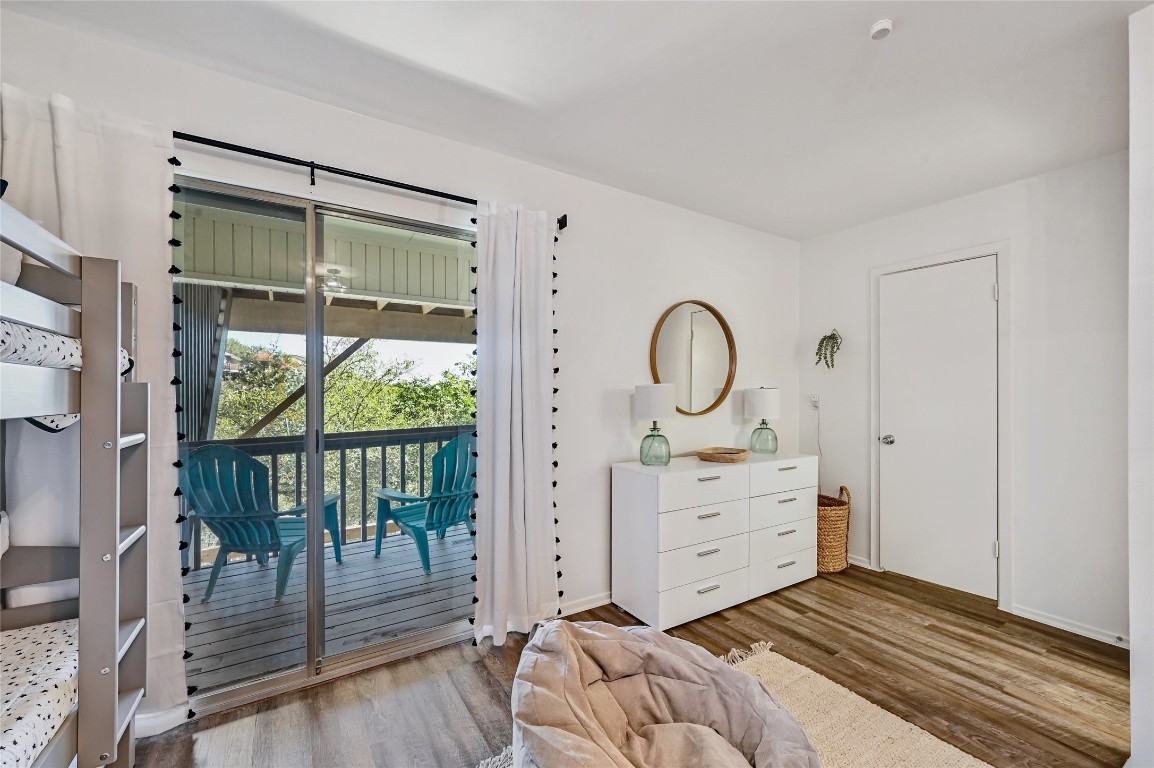 115 Comanche Drive Point Venture, TX 78645 - Photo 20 of 31 a view of a bedroom with wooden floor and windows