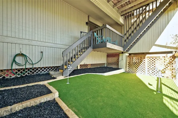 a view of balcony with furniture