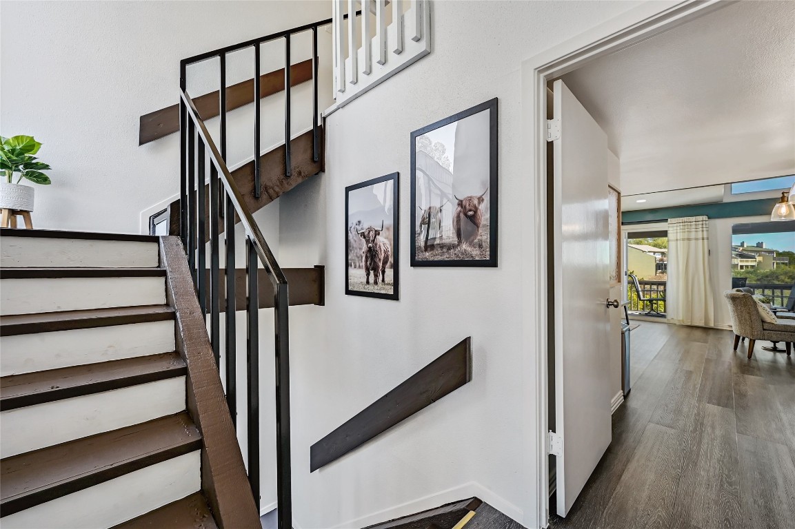 115 Comanche Drive Point Venture, TX 78645 - Photo 7 of 31 a view of hallway with wooden floor and stairs