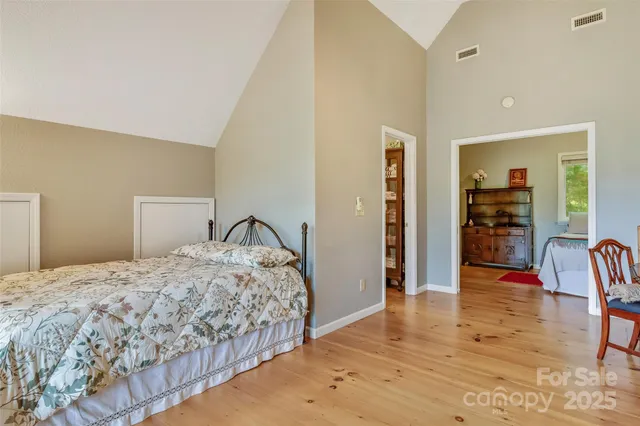 a bedroom with a bed and chair