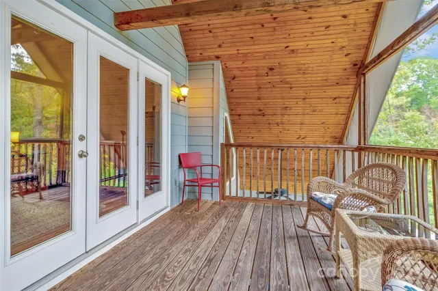 a view of a balcony with wooden floor
