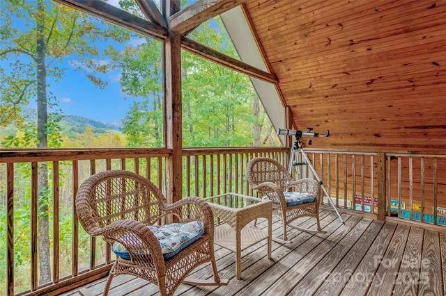 a view of a patio with a table chairs and balcony