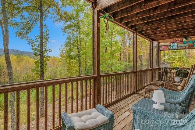 a view of a two chairs in the balcony