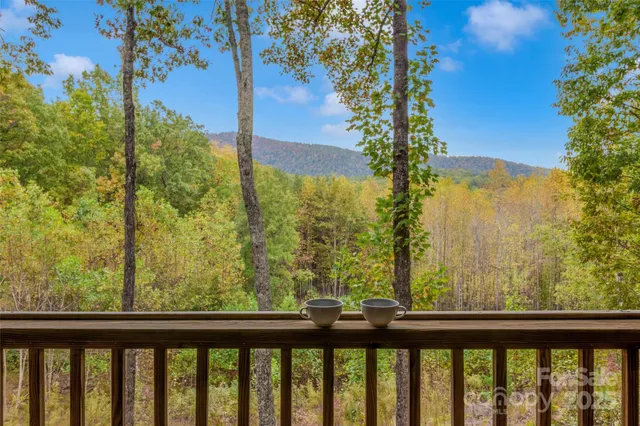 a view of a balcony with chairs