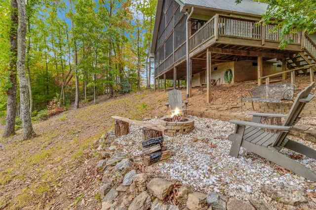 a view of a patio with a table and chairs and potted plants