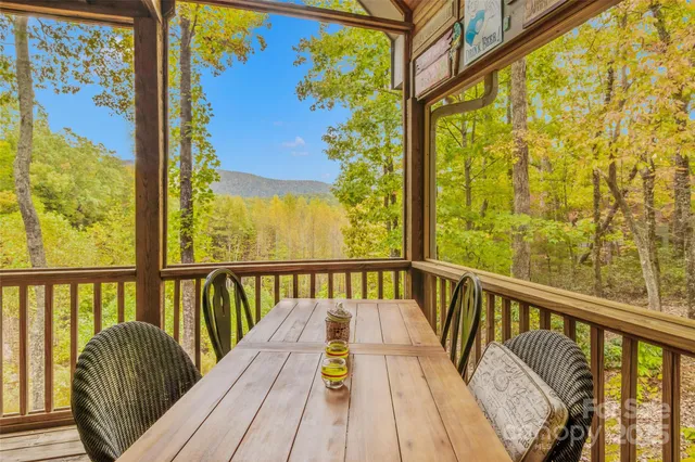 a view of balcony with wooden floor