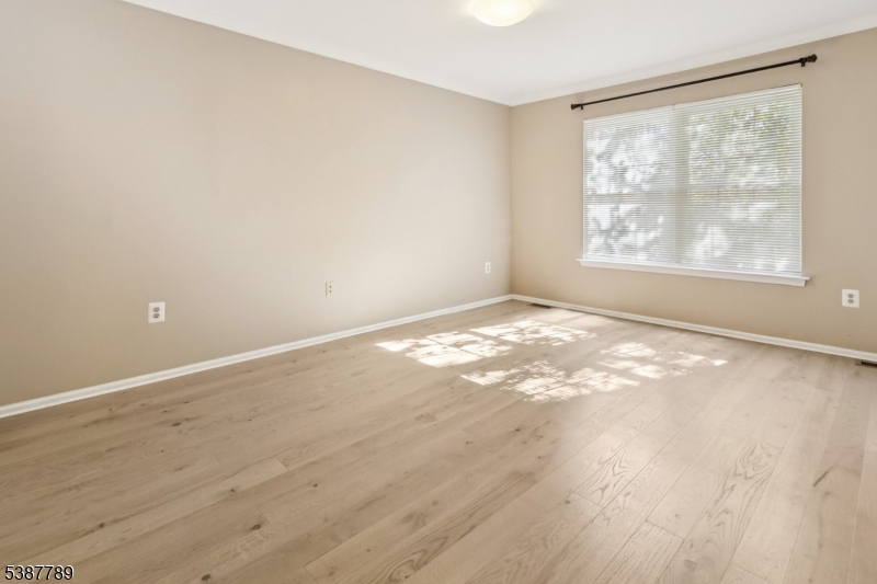 10 Brookline Court Princeton, NJ 08540 - Photo 19 of 31 an empty room with wooden floor and windows