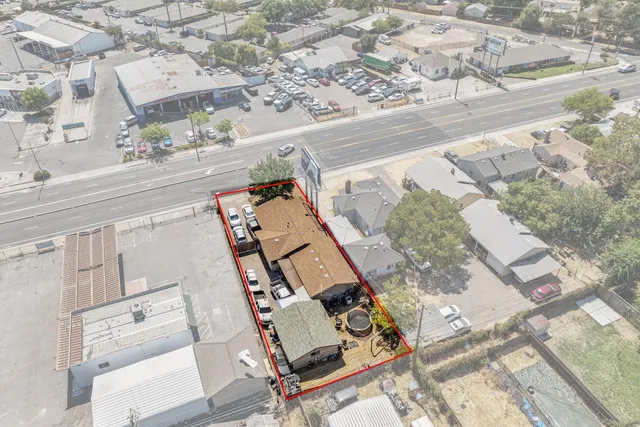 an aerial view of a house with a ocean view