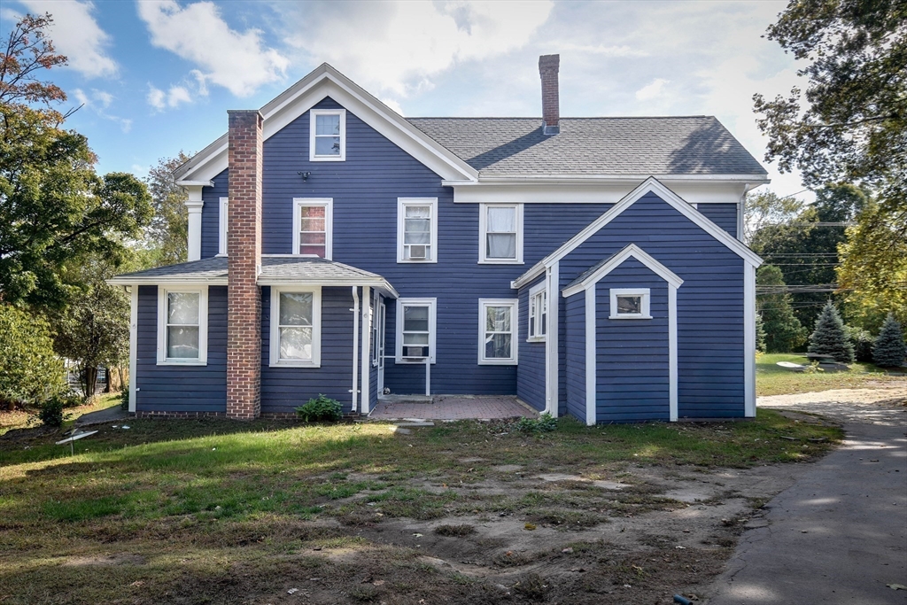 136 Commonwealth Road Wayland, MA 01778 - Photo 2 of 27 a front view of a house with garden
