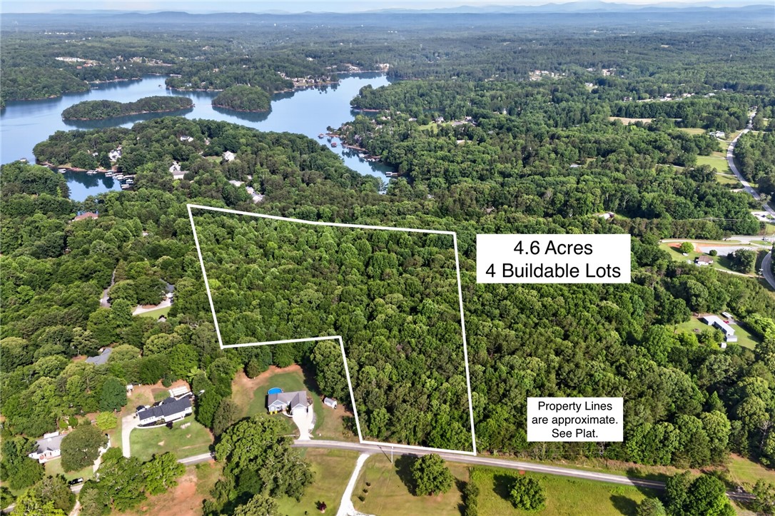 0 Barnes Road Seneca, SC 29672 - Photo 2 of 16 A sprawling 4.6-acre property, offering four buildable lots with abundant natural beauty and lake views.