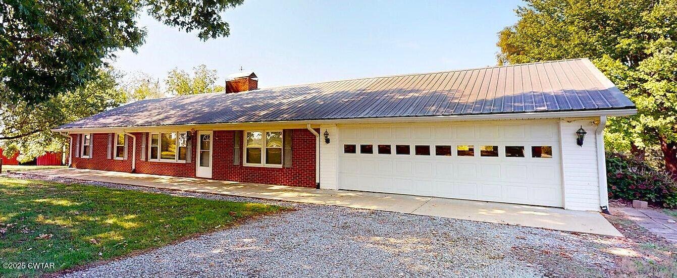 67 Ode Reed Road Dyer, TN 38330 - Photo 11 of 24 a front view of a house with a garden and yard
