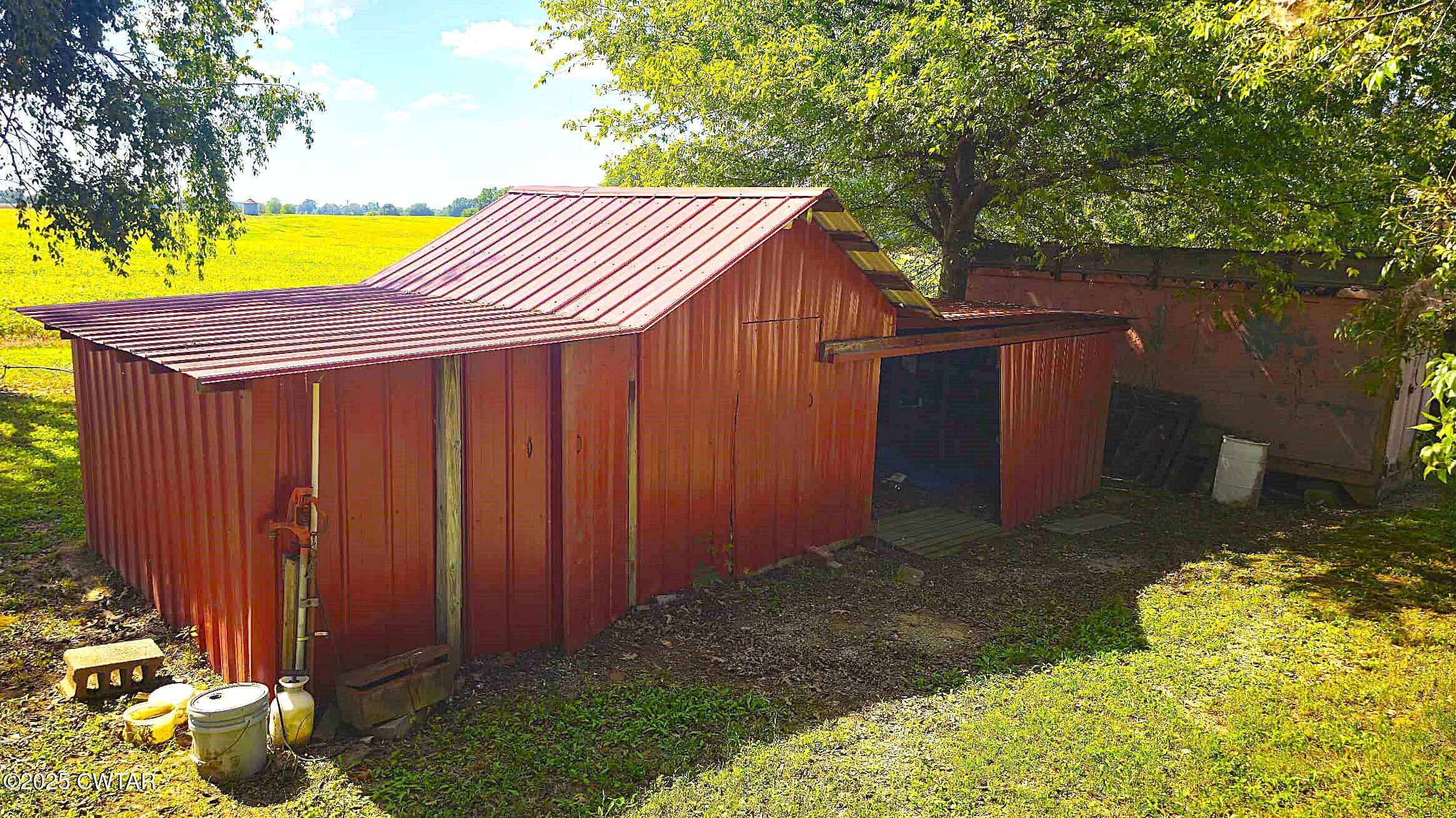 67 Ode Reed Road Dyer, TN 38330 - Photo 14 of 24 a backyard of a house with swimming pool in front of it