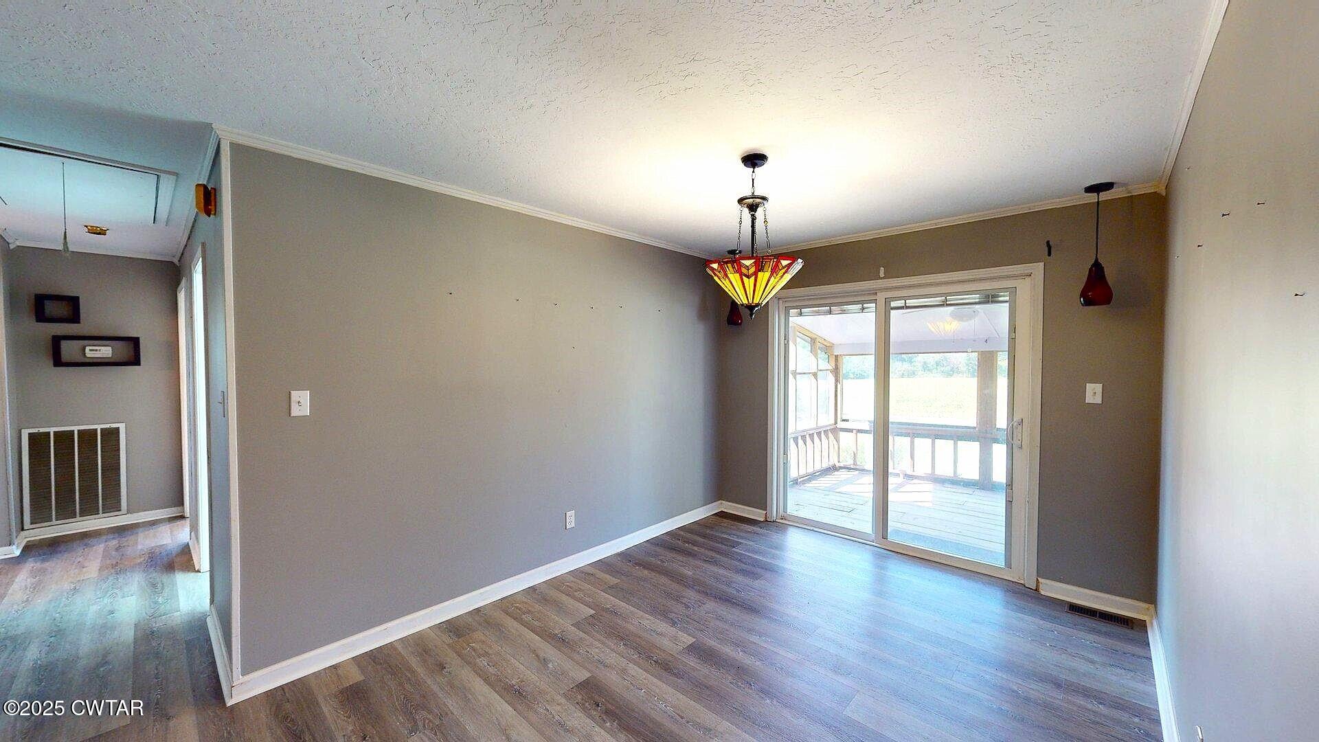 67 Ode Reed Road Dyer, TN 38330 - Photo 17 of 24 an empty room with wooden floor and window