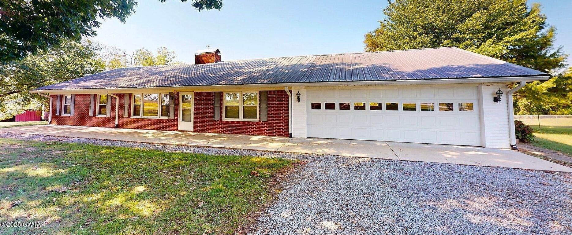 67 Ode Reed Road Dyer, TN 38330 - Photo 2 of 24 a front view of a house with a yard