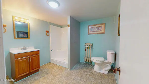 a bathroom with a toilet and a sink