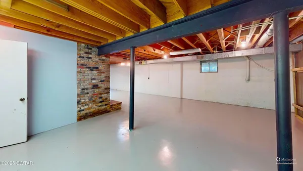 a view of an empty room with a balcony