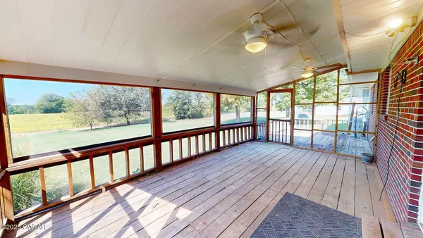 a view of wooden balcony with wooden floor