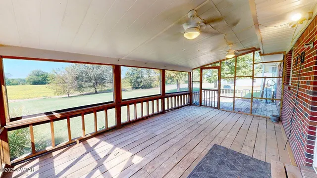 a view of wooden balcony with wooden floor