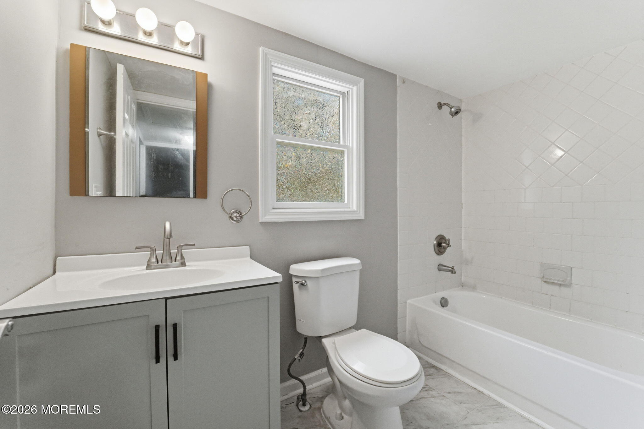 466 Stagecoach Road Millstone Township, NJ 08510 - Photo 13 of 16 a bathroom with a sink a toilet and shower