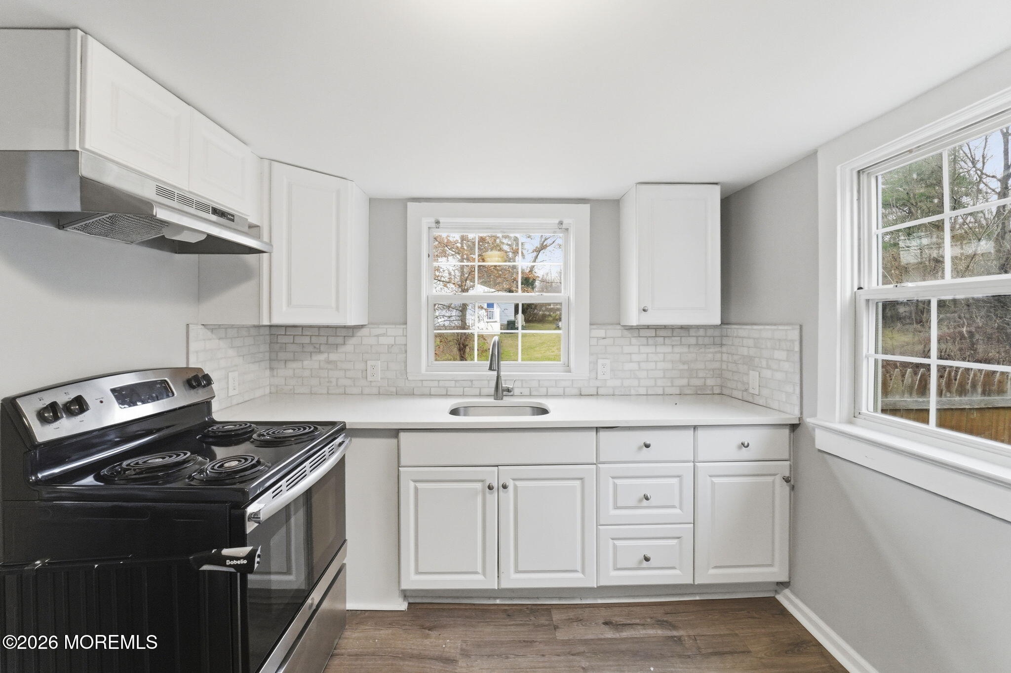 466 Stagecoach Road Millstone Township, NJ 08510 - Photo 4 of 16 a kitchen with cabinets appliances a sink and a window