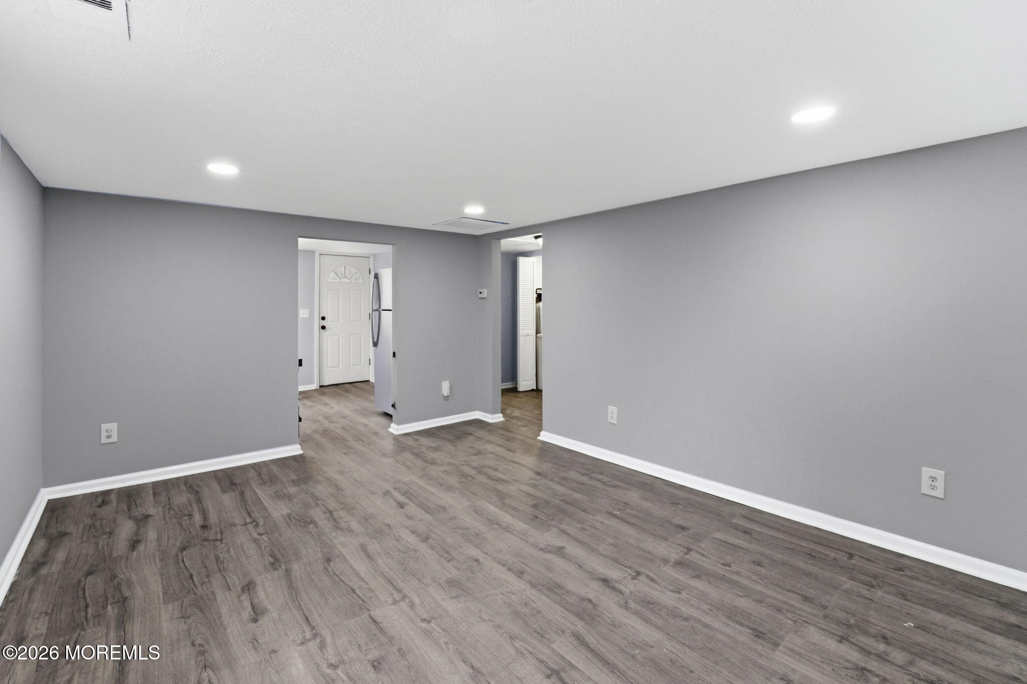 466 Stagecoach Road Millstone Township, NJ 08510 - Photo 7 of 16 a view of an empty room with wooden floor