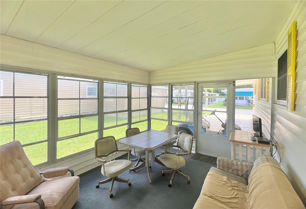 1100 South Belcher Road, Unit 115 Largo, FL 33771 - Photo 7 of 54 Florida room under carport