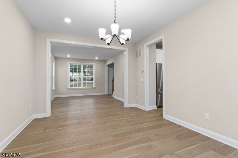 105 Junction Road Hampton, NJ 08827 - Photo 16 of 40 a view of an empty room with wooden floor and a window