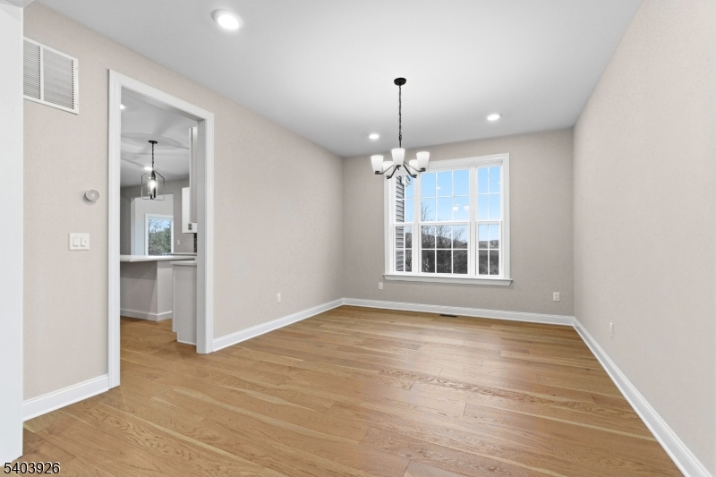105 Junction Road Hampton, NJ 08827 - Photo 17 of 40 a view of an empty room with a window and wooden floor