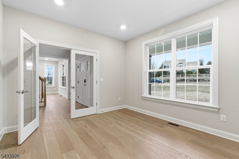 105 Junction Road Hampton, NJ 08827 - Photo 18 of 40 a view of empty room with wooden floor and fan