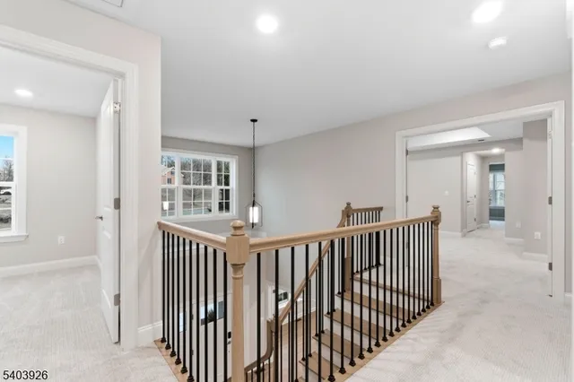 a view of a hallway with windows