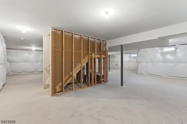 a view of an empty room with closet